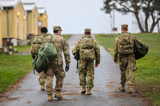 U.S. Army Soldiers from the 91st Brigade Engineer Battalion, 1st Armored Brigade Combat Team, 1st Cavalry Division carry their duffel bags to their temporary barracks at Camp Aachen in Grafenwoehr, Germany, Dec. 19, 2018. This is the last stop of 1-1 CD’s rotation supporting Atlantic Resolve, an exercise to improve the interoperability of U.S. Forces with their NATO allies and partners. Walkability and a proximity to the barracks are important factors in siting the Operational Readiness Training Center in the Grafenwoehr Training Area’s Area Development Execution Plan. 