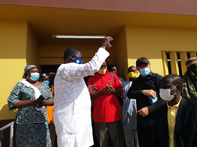 The Mayor of Malanville, accepts keys to a newly constructed health clinic from Humanitarian Assistance Program Coordinator Cosme Quenum, a local national with the U.S. Embassy in Cotonou, Benin in the village of Money, Benin in Africa at the end of January 2021. The clinic and various associated facilities also built with it comprise one of two similar clinic projects recently completed by the U.S. Army Corps of Engineers in that region of Benin through funding from AFRICOM and coordinated closely with the U.S. State Department. (Courtesy Photo)