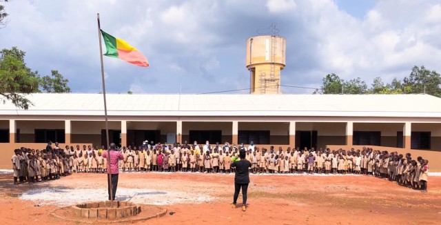 Dozens of students pose in front of a recently completed school facility in Kpomasse, Benin in Africa. The school is one of three school projects in the country recently constructed by the U.S. Army Corps of Engineers, Europe District. The U.S. Army Corps of Engineers, Europe District manages the constructions of Humanitarian Assistance projects like this one and others in Benin and in several other countries throughout Africa in support of AFRICOM and coordinated closely with the U.S. State Department. (Photo courtesy of Cosme Quenum)