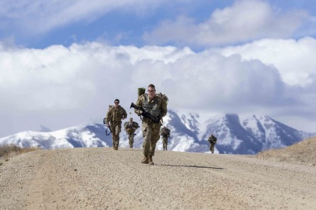 Soldiers participate in a six-mile ruck march during the Utah National Guard Best Warrior Competition at Camp Williams, Utah, March 23, 2021.