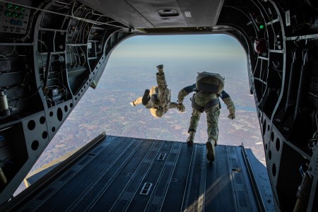 Maryland Army National Guard paratroopers begin to free-fall towards a drop zone from 12,000 feet above sea level during an airborne training operation at Aberdeen Proving Grounds, Maryland, Nov. 7, 2020.