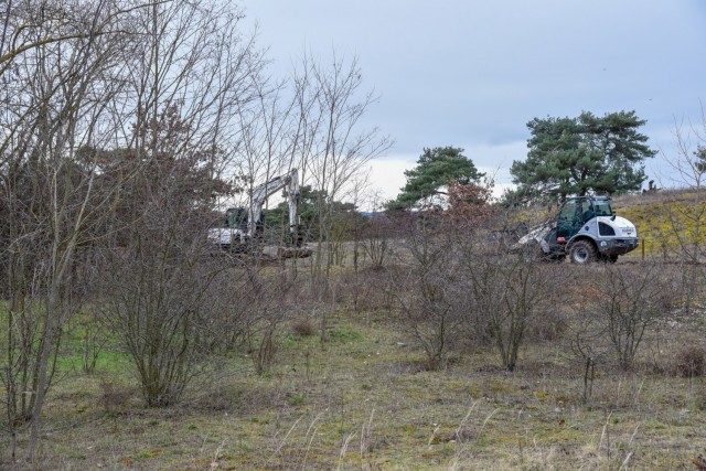 Contactor vehicles grade a path to expand and enhance a training site at the Mainz Sand Dunes Local Training Area near Mainz, Germany, Oct. 22, 2021 (U.S. Army photo by Alfredo Barraza)