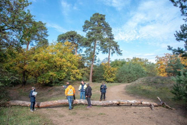 Jennifer Paterson (far left) with the U.S. Army Corps of Engineers Europe District Environmental Branch surveys a path with members of Training Support Center Wiesbaden, the Training Support Activity Europe, 7th U.S. Army Training Command, and the Wiesbaden Directorate of Public Works Environmental Office at the Mainz Sand Dunes Local Training Area near Mainz, Germany, Oct. 22, 2021 (U.S. Army photo by Alfredo Barraza)