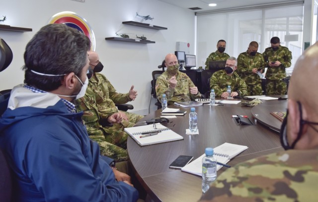 Brig. Gen. Douglas Lowrey, commander of U.S. Army Security Assistance Command, responds to questions during a key leader engagement with the Vice Minister of Defense for strategy and planning, Jairo Garcia Guerrero, blue jacket, and other senior Colombian military leadership, at the División de Aviación Asalto Aéreo headquarters in Bogota, Colombia, 6 April 2021. Brig. Gen. Lowrey, and members of his staff, visited several sites to see the impact of U.S. security assistance and foreign military sales, in support of the Colombian military in defending their country from counter-narcotic and terrorist threats. (U.S. Army photo by Richard Bumgardner)