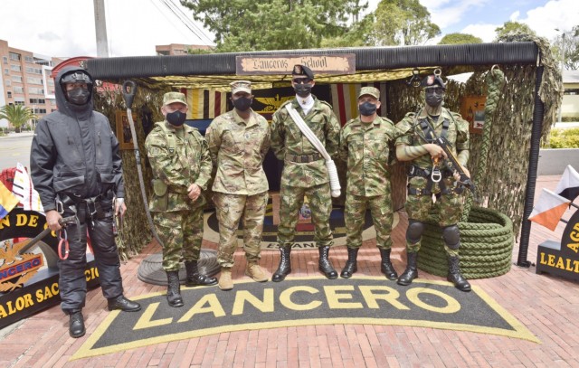 Command Sgt. Maj. Sean Rice, senior enlisted advisor at U.S. Army Security Assistance Command, poses for a photo with Colombian Lanceros (similar to Army Rangers) and senior enlisted leaders during day 4 of a key leader engagement with the Colombian Army at the Canton Norte base in Bogota, Colombia, 8 April 2021. CSM Rice joined Brig. Gen. Douglas Lowrey, USASAC commander, and members of his staff, as they visited several sites to see the impact of U.S. security assistance and foreign military sales, in support of the Colombian military in defending their country from counter-narcotic and terrorist threats. (U.S. Army photo by Richard Bumgardner)