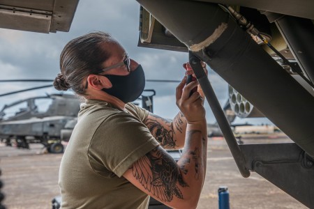 Soldiers of the 25th Combat Aviation Brigade perform routine maintenance on AH-64 Apache Helicopters at Wheeler Army Airfield, Hawaii. Maintainers identify, troubleshoot, and repair any issues the aircraft may be experiencing.