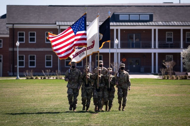 The colorguard of the United States Army Reserve Legal Command retires the colors during a change of command ceremony held Friday, March 26 on Joint Base Myer-Henderson Hall, Virginia.
