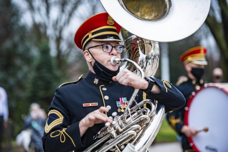 Members of the U.S. Army Band, &#34;Pershing&#39;s Own,&#34; perform at a wreath-laying ceremony at the Tomb of the Unknown Soldier at Arlington National Cemetery in Arlington, Va., March 25, 2021.