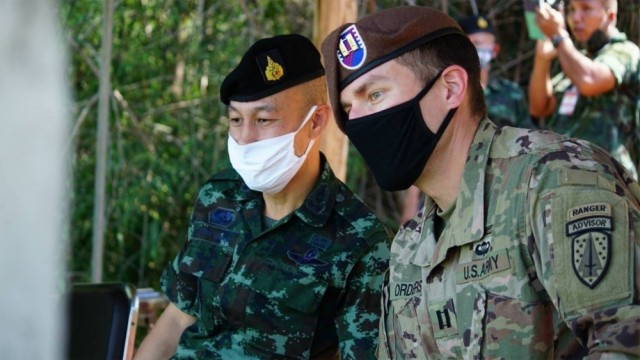 Capt. Matthew Orders, a Team Leader with 1st Battalion, 5th Security Force Assistance Brigade, observes a training event alongside Col. Aekanan Hemabut, the Royal Thai Army 111th Infantry Regimental Combat Team Commander, Aug. 25, 2020, in Chachoengsao, Thailand. 

