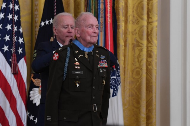 President Joseph Biden presents the Medal of Honor to retired Col. Ralph Puckett Jr. during a ceremony at the White House in Washington, D.C., May 21, 2021. Puckett was awarded the Medal of Honor for his heroic actions while serving then as commander of the Eighth Army Ranger Company when his company of 57 Rangers was attacked by Chinese forces at Hill 205 near the Chongchon River, during the Korean Conflict on November 25-26, 1950.