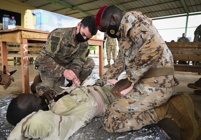 Staff Sgt. John Rangel, a medical advisor with 2nd Battalion, 2nd Security Force Assistance Brigade, demonstrates lifesaving techniques during a class on tactical combat casualty care in an undisclosed location in Djibouti Feb. 9, 2021.