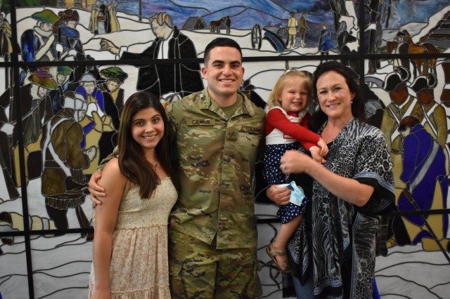 Pfc. Mason Calhoun, takes a photo with Family members after the Advanced Individual Training graduation ceremony for 56M, religious affairs specialist, of class 21-007 on May 13. His Family is the first to attend a USACHCS graduation in over a year. (Photo by Mel Slater)