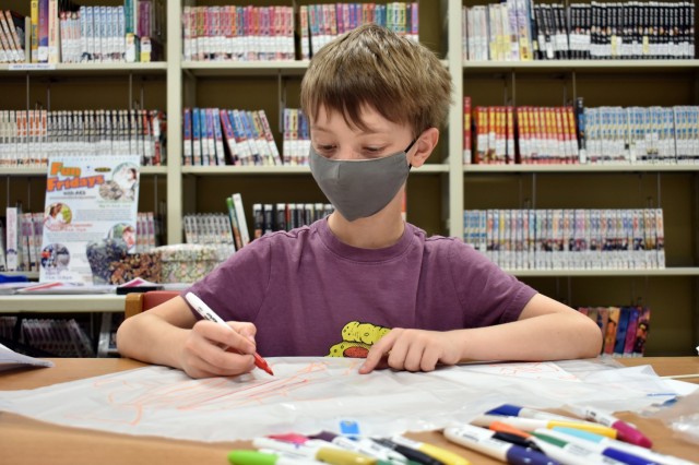 Ricky Chapman, 8, makes a kite during a “Fun Friday” event at the Sagamihara Family Housing Area Library, SFHA, Japan, May 28.