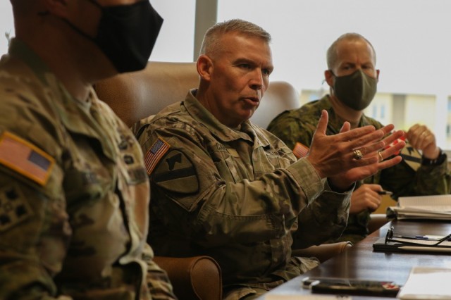 Col. Kevin Capra, 1st Cavalry Division chief of staff, discusses collaboration concepts and efforts to better field and test future warfighter capabilities with representatives from the U.S. Army Combat Capabilities Development Command [DEVCOM] Army Research Laboratory and the U.S. Army Operational Test Command during a round table discussion at the division&#39;s Headquarters at Fort Hood, Texas, May 12, 2021. The visit opens the way to align and build relationships that collaborate and formalize beneficial partnerships in technology, modernization and innovation. 