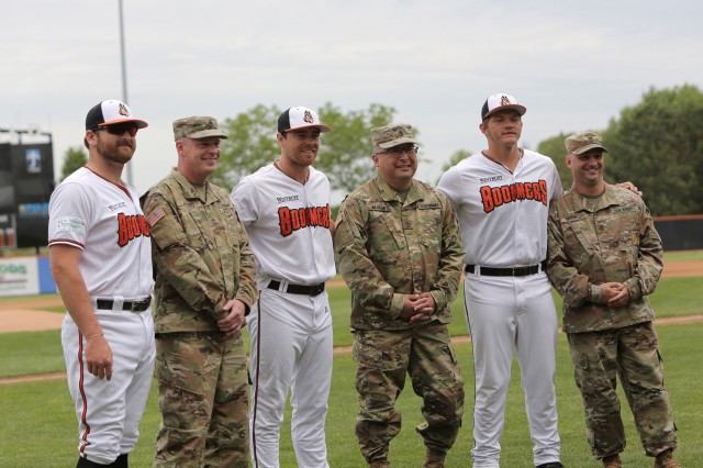 Soldiers assigned to the 85th U.S. Army Reserve Support Command headquarters pause for a photo with players from the Schaumburg Boomers baseball team, May 31, 2021, in Schaumburg, Illinois during a Memorial Day home game against the Gateway Grizzlies. The Soldiers participated in pre-game activities throwing out the ceremonial first pitch and conducted a presentation of colors during the playing of the National Anthem. 
(U.S. Army Reserve Photo by Anthony L. Taylor)