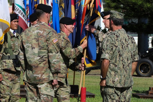 U.S. Army Command Sgt. Maj. Scott A. Brzak, right, the U.S. Army Pacific command sergeant major, passes the unit's colors to Gen. Paul J. LaCamera, outgoing USARPAC commander during the change of command ceremony June 4, 2021 at Fort Shafter, Hawaii. The ceremony was hosted by U.S. Navy Adm. John C. Aquilino, U.S. Indo-Pacific commander. (U.S. Army photo by Staff Sgt. Jennifer A. Delaney)