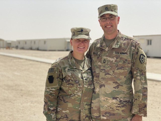 Spc. Emilee Richards (left), a unit supply specialist in the 2nd General Support Battalion, 104th Aviation Regiment, West Virginia Army National Guard and Master Sgt. Kendall Hodge (right), a Logistics noncommissioned officer in the 111th Engineer Brigade, recently crossed paths while deployed in Kuwait. This duo also happens to be father and daughter.