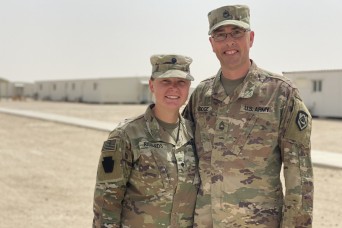 Father and daughter reunite in Kuwait during deployment