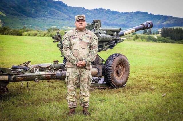 Schofield Barracks, HI — Sgt. 1st Class Mark Peralta a 13J, Senior Fire Control Non-Commissioned Officer, assigned to 25th Infantry Division Artillery, 25th Infantry Division during M119 Howitzer live fire range at Schofield Barracks, Hawaii. (U.S. Army photo by Spc. Jessica B. Scott)