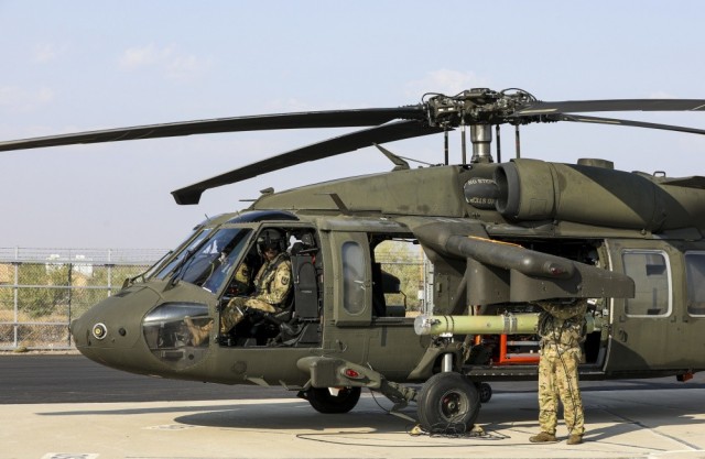 An Air Launched Effects system is loaded onto a UH-60L Black Hawk as capabilities testing commences during the first series of Project Convergence exercises at Yuma Proving Ground, Ariz., Sept. 15, 2020. The Project Convergence 21 demonstrations are scheduled to begin in November 2021. 