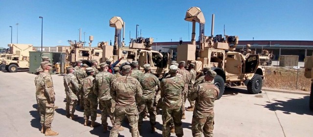 Soldiers huddle during Counter-Small Unmanned Aircraft Systems home-station training at Fort Carson, Colo. The Soldiers were preparing for a deployment to the U.S. Central Command region. 