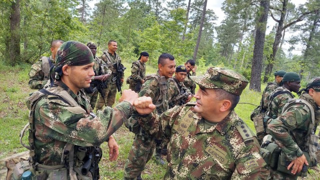 Maj. Gen. German Lopez, Colombian Army chief of force generation, greets Colombian soldiers during a visit to the Joint Readiness Training Center at Fort Polk, La., June 9, 2021. The Colombian Army is the second South American army to conduct bilateral training with a U.S. Army unit as part of a JRTC rotation.