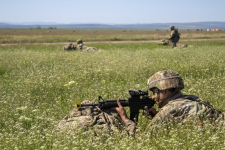 A soldier performs security operations during Exercise Swift Response at Boboc Air Base, Romania, May 10, 2021. Swift Response is designed to validate U.S. European Command&#39;s ability to send high readiness forces into a designated area while advancing airborne interoperability among NATO allies.

