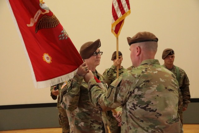 Lt. Col. Meghann Sullivan takes the 5th Battalion, 5th Security Force Assistance Brigade guidon from 5th SFAB Commander, Col. Andrew Watson after its relinquished by outgoing Commander, Col. Rhett Blackmon at Joint Base Lewis McChord, Washington, today.  Sullivan becomes the first women to take command of an SFAB battalion in the enterprise&#39;s four-year history.
