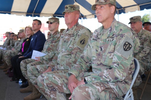 Center, Command Sgt. Maj. Patrick McKie, senior enlisted leader, 63rd Readiness Division and Command Sgt. Maj. Robert Boudnik, senior enlisted leader, Army Reserve Medical Command listen to a speaker during the Spc. Jameson L. Lindskog U.S. Army Reserve Center memorialization ceremony June 29, 2021 at Parks Reserve Forces Training Area in Dublin, Calif. Lindskog, a resident of Pleasanton, Calif., was killed in action March 29, 2011 while serving as a combat medic with the 2nd Battalion, 327th Infantry Regiment, 1st Brigade Combat Team, 101st Airborne Division in Afghanistan. He posthumously received the Silver Star for his heroic actions that day.
(Photo by Sgt. 1st Class Matthew Chlosta)