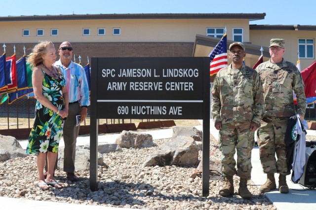 During the Spc. Jameson L. Lindskog U.S. Army Reserve Center memorialization ceremony, from left to right, Mrs. Jo Lindskog, Lindskog’s stepmother, looks at the just unveiled plaque as her and Mr. Curtis Lindskog, Lindskog’s father; Maj. Gen. Jonathan Woodson, commanding general, Army Reserve Medical Command and Brig. Gen. Joseph Marsiglia, commanding general, Army Reserve Medical Readiness and Training Command listen to the reading of the Army Reserve Center dedication by Mr. Doug Miller, the master of ceremony, June 29, 2021 at Parks Reserve Forces Training Area in Dublin, Calif. Lindskog, a resident of Pleasanton, Calif., was killed in action March 29, 2011 while serving as a combat medic with the 2nd Battalion, 327th Infantry Regiment, 1st Brigade Combat Team, 101st Airborne Division in Afghanistan. He posthumously received the Silver Star for his heroic actions that day.
(Photo by Sgt. 1st Class Matthew Chlosta)   