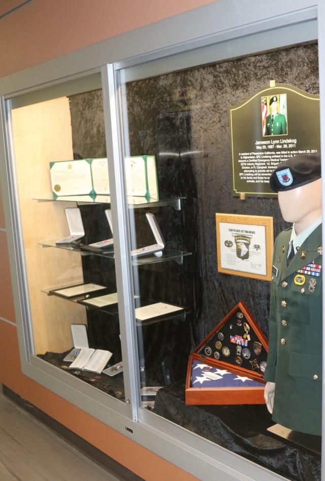 A memoriam flag box sits in the glass display case memorial, inside Spc. Jameson L. Lindskog U.S. Army Reserve Center after a memorialization ceremony June 29, 2021 at Parks Reserve Forces Training Area in Dublin, Calif. Lindskog, a resident of Pleasanton, Calif., was killed in action March 29, 2011 while serving as a combat medic with the 2nd Battalion, 327th Infantry Regiment, 1st Brigade Combat Team, 101st Airborne Division in Afghanistan. He posthumously received the Silver Star for his heroic actions that day.
(Photo by Sgt. 1st Class Matthew Chlosta)