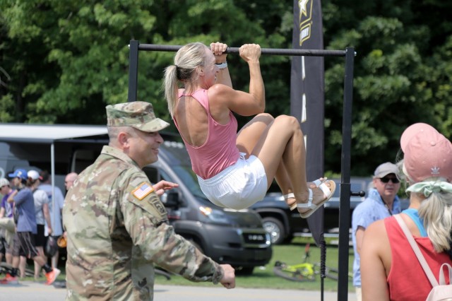 Renee Eckberg, a fitness coach from Oakfield, Wisconsin, performs Army Leg Tucks, one of six events in the U.S. Army’s new Army Combat Fitness Test, during the Fourth of July NASCAR Cup Series race at Road America, Elkhart Lake, Wisconsin, July 4, 2021. The U.S. Army recruiting battalion, along with the Appleton Recruiting Company brought recruiters and displays from across their area to meet with citizens, allow them to experience Army technology and evaluate opportunities in military service. Brig. Gen. Ernest Litynski, Commanding General, 85th U.S. Army Reserve Support Command, attended the race as the Army’s senior leader and swore in 20 future Soldiers at the pre-race ceremonies.
(U.S. Army Reserve photo by Anthony L. Taylor)