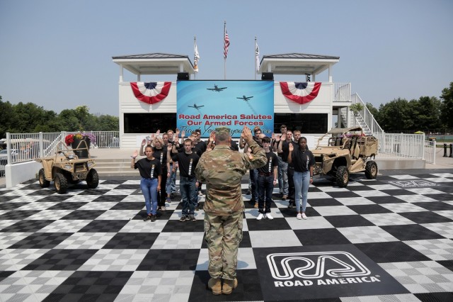 Brig. Gen. Ernest Litynski, Commanding General, 85th U.S. Army Reserve Support Command, swears in future Soldiers, in the Winner’s Circle, during the Fourth of July NASCAR Cup Series race at Road America, Elkhart Lake, Wisconsin, July 4, 2021. The U.S. Army recruiting battalion, along with the Appleton Recruiting Company brought recruiters and displays from across their area to meet with citizens, allow them to experience Army technology and evaluate opportunities in military service. Litynski attended the race as the Army’s senior leader and swore in 20 future Soldiers at the pre-race ceremonies.
(U.S. Army Reserve photo by Anthony L. Taylor)