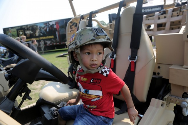Michael Taylor, 3, pauses for a photo in an Army Polaris MRZR 4 during the Fourth of July NASCAR Cup Series race at Road America, Elkhart Lake, Wisconsin, July 4, 2021. Litynski attended the race as the Army’s senior leader and swore in 20 future Soldiers at the pre-race ceremonies. The U.S. Army recruiting battalion, along with the Appleton Recruiting Company brought recruiters and displays from across their area to meet with citizens, allow them to experience Army technology and evaluate opportunities in military service.
(U.S. Army Reserve photo by Anthony L. Taylor)