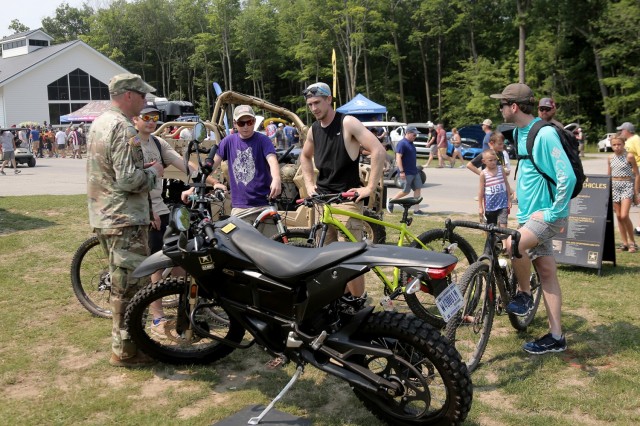 Cyclists are introduced to an Army Zero FX Z-Force 5.7 Electric Motorcycle during the Fourth of July NASCAR Cup Series race at Road America, Elkhart Lake, Wisconsin, July 4, 2021. The U.S. Army recruiting battalion, along with the Appleton Recruiting Company brought recruiters and displays from across their area to meet with citizens, allow them to experience Army technology and evaluate opportunities in military service. Brig. Gen. Ernest Litynski, Commanding General, 85th U.S. Army Reserve Support Command, attended the race as the Army’s senior leader and swore in 20 future Soldiers at the pre-race ceremonies.
(U.S. Army Reserve photo by Anthony L. Taylor)