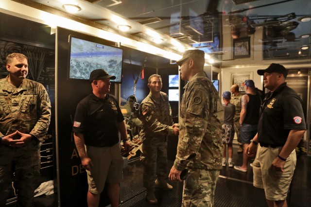 Brig. Gen. Ernest Litynski, center, Commanding General, 85th U.S. Army Reserve Support Command, receives a tour of the U.S. Army Special Operations display trailer from recruiters assigned to the U.S. Army Recruiting Battalion-Milwaukee during the Fourth of July NASCAR Cup Series race at Road America, Elkhart Lake, Wisconsin, July 4, 2021. Litynski attended the race as the Army’s senior leader and swore in 20 future Soldiers at the pre-race ceremonies. The U.S. Army recruiting battalion, along with the Appleton Recruiting Company brought recruiters and displays from across their area to meet with citizens, allow them to experience Army technology and evaluate opportunities in military service.
(U.S. Army Reserve photo by Anthony L. Taylor)