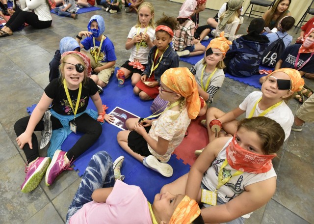 More than 100 children are participating in Vacation Bible School this week at the Main Post Chapel, hosted by Fort Leonard Wood’s Religious Support Office. The children are supervised by a group of about 45 volunteers as they rotate through various games, crafts and Bible story stations while divided into age groups ranging from preschoolers through sixth grade. Different themes each day have the children and volunteers dressing as pirates, island vacationers and in team colors.