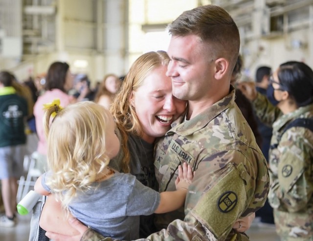A Soldier with North Carolina National Guard’s 30th Armored Brigade Combat Team reunites with his family, Aug. 15, 2020, in Charlotte, N.C. The Soldiers returned home after a year-long deployment to the Middle East in support of Operation Inherent Resolve and Operation Spartan Shield.