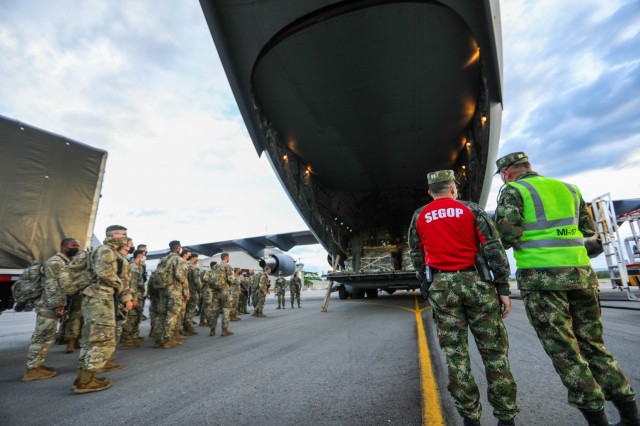 U.S. Army paratroopers assigned to 2nd battalion, 501st Parachute Infantry Regiment, 1st Brigade Combat Team, 82nd Airborne Division arrive at Tolemaida Air Base, Nilo, Colombia for a Dynamic Force Employment on July 21, 2021. The DFE was conducted to increase interoperability with the Colombian military and to demonstrate operational readiness and regional unity. (U.S. Army photo by Pfc. Joshua Taeckens)(This photo was edited from the original version)