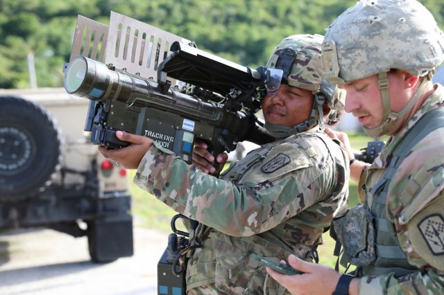 Ohio National Guard's Spc. Kiya Marshall and Staff Sgt. Tyler Hamilton, assigned to Alpha Battery, 1st Battalion, 174th Air Defense Artillery Regiment, operate a man-portable air-defense system to engage an enemy aircraft during exercise Forager 21 on July 30, 2021, Andersen Air Force Base, Guam. The Avenger is a self-propelled surface-to-air missile system which provides mobile, short-range air defense protection for ground units. Exercise Forager 21 is a U.S. Army Pacific exercise designed to test and refine the Theater Army’s ability to flow landpower forces into the theater, execute command and control of those forces, and effectively employ them in support of our allies, partners, and national security objectives in the region. (Photo by Army Spc. Olivia Lauer)