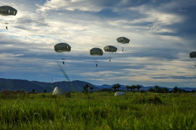 U.S. Army and Colombian joint military paratroopers land, July 25, 2021, at Tolemaida Air Base, Colombia. The jump was part of a six-day Dynamic Force Employment airborne exercise, also known as Exercise Hidra II, between the U.S Army and Colombian joint military. (U.S. Army photo by Pfc. Joshua Taeckens) 
