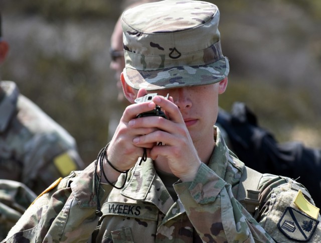 Pfc. Tony Weeks, assigned to Company D, 229th Military Intelligence Battalion, uses a compass during a battalion-level land navigation competition at Fort Ord National Monument, Calif., Aug. 7, 2021.