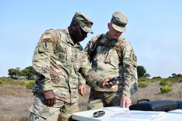 Sgts. 1st Class Aaron Reynolds, left, and Michael Turner, assigned to the 229th Military Intelligence Battalion, confirm grid coordinates before the start of battalion’s land navigation competition at Fort Ord National Monument, Calif., Aug. 7., 2021.