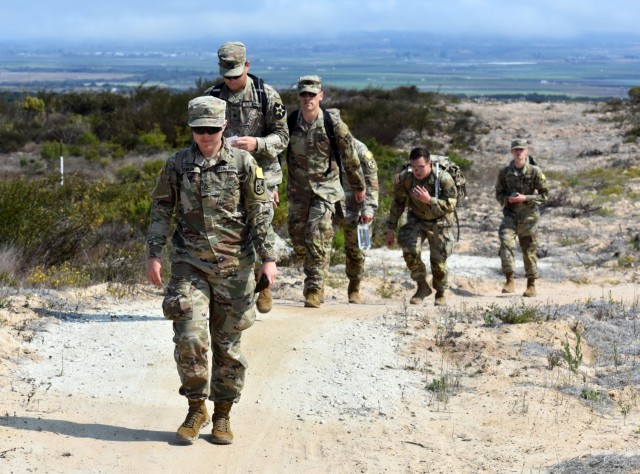 Pfc. Alicia Bohlen, assigned to Company D, 229th Military Intelligence Battalion, leads her team during a battalion-level land navigation competition at Fort Ord National Monument, Calif., Aug. 7, 2021.