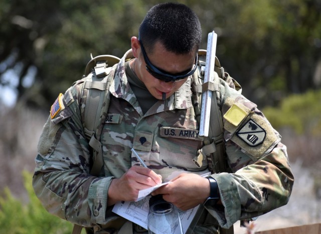 Spc. Julian Taitague, assigned to Company D, 229th Military Intelligence Battalion, helps his team navigate during a battalion-level land navigation competition at Fort Ord National Monument, Calif., Aug. 7.