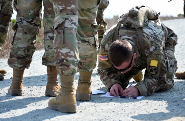 A Soldier assigned to the 229th Military Intelligence Battalion helps his team navigate during a battalion-level land navigation competition at Fort Ord National Monument, Calif., Aug. 7, 2021.