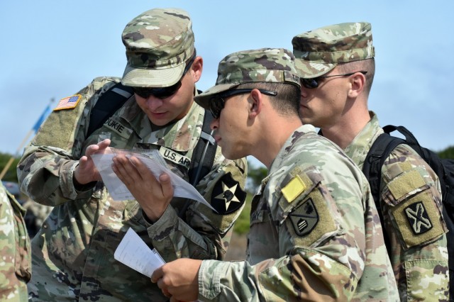 From left, Spcs. Bryan Roukie, Julian Taitague and Taylor Julian, all assigned to Company D, 229th Military Intelligence Battalion, participate in a battalion-level land navigation competition at Fort Ord National Monument, Calif., Aug. 7.