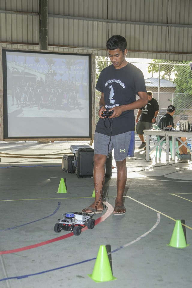 Ebeye high school student Jesse Mote drives his team car through a checkpoint during the pre-finale testing period for the Massachusetts Institute of Technology  Lincoln Laboratory Beaver Works Summer Institute - Autonomous RACECAR Grand Prix Aug. 2, 2021. High school students from Ebeye and Kwajalein showcased technological teamwork and coding skills for parents and friends at the Jabro Sports Complex following the culmination of the multi-week summer institute.