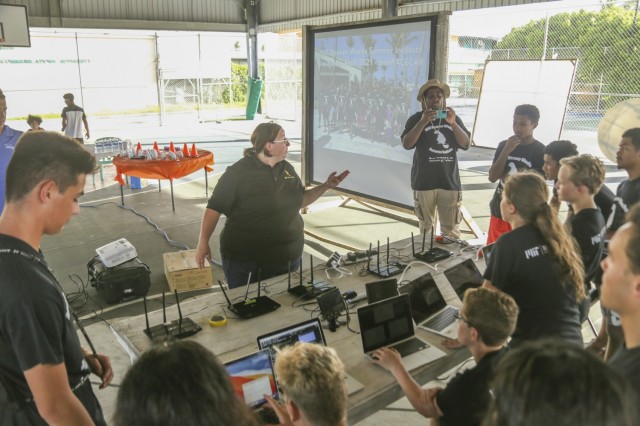 A pre-event pep talk: Massachusetts Institute of Technology, Lincoln Laboratory program advisor Dr. Sarah Willis addresses Ebeye and Kwajalein high school student participants in the Beaver Works Summer Institute - Autonomous RACECAR Grand Prix finale at the Jabro Sports Complex on Ebeye Aug. 2, 2021. The students showcased their talents after completing the multi-week intensive summer program.