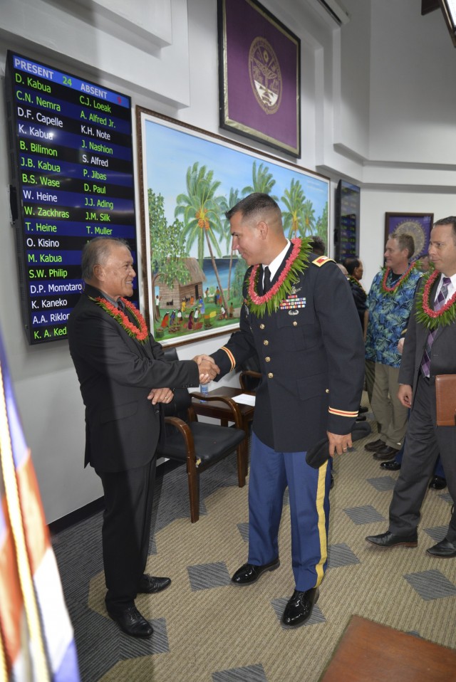 Republic of the Marshall Islands President David Kabua, left, greets U.S. Army Garrison-Kwajalein Atoll Commander Col. Thomas Pugsley at the Nitijela on Majuro Aug. 9, 2021.